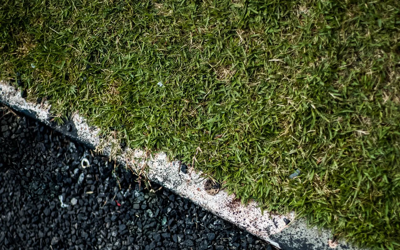 Close up of asphalt and sealcoating materials on a residential job site