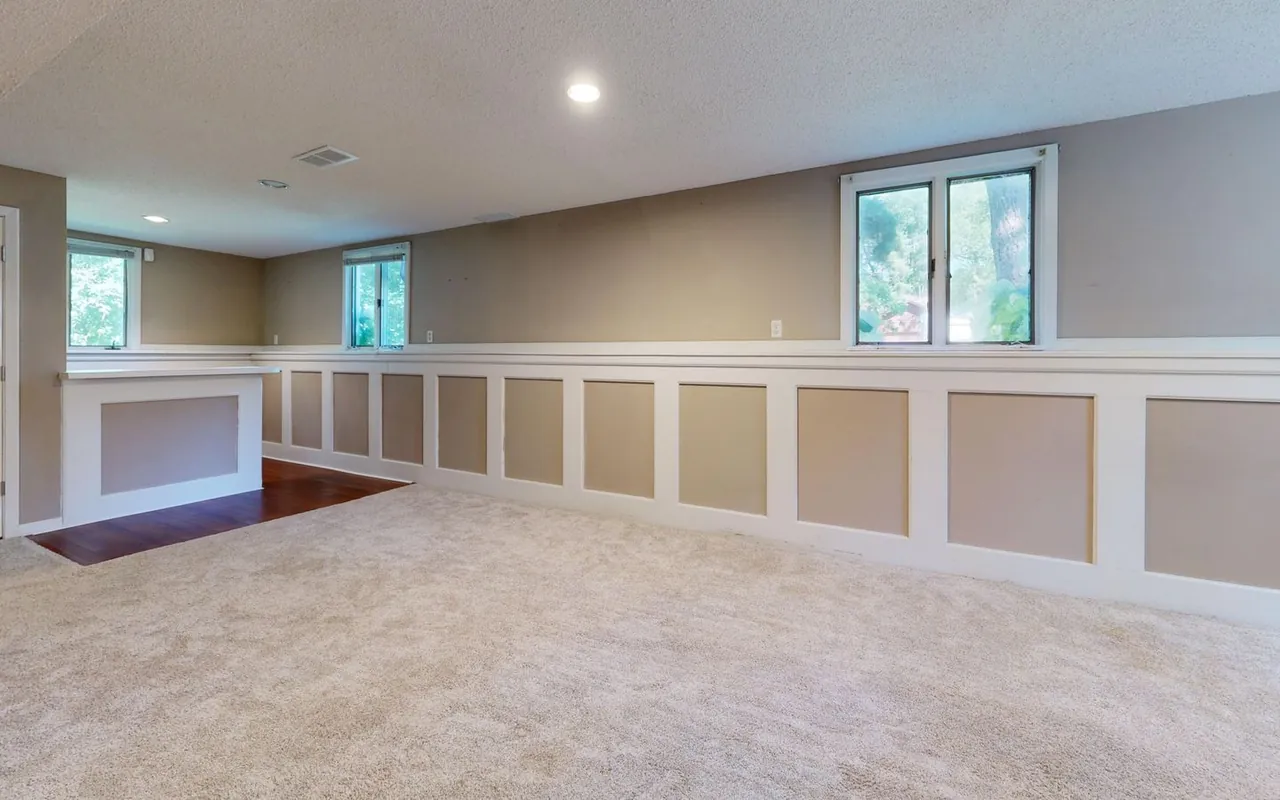 Contractor installing basement finishing at a home in the United States