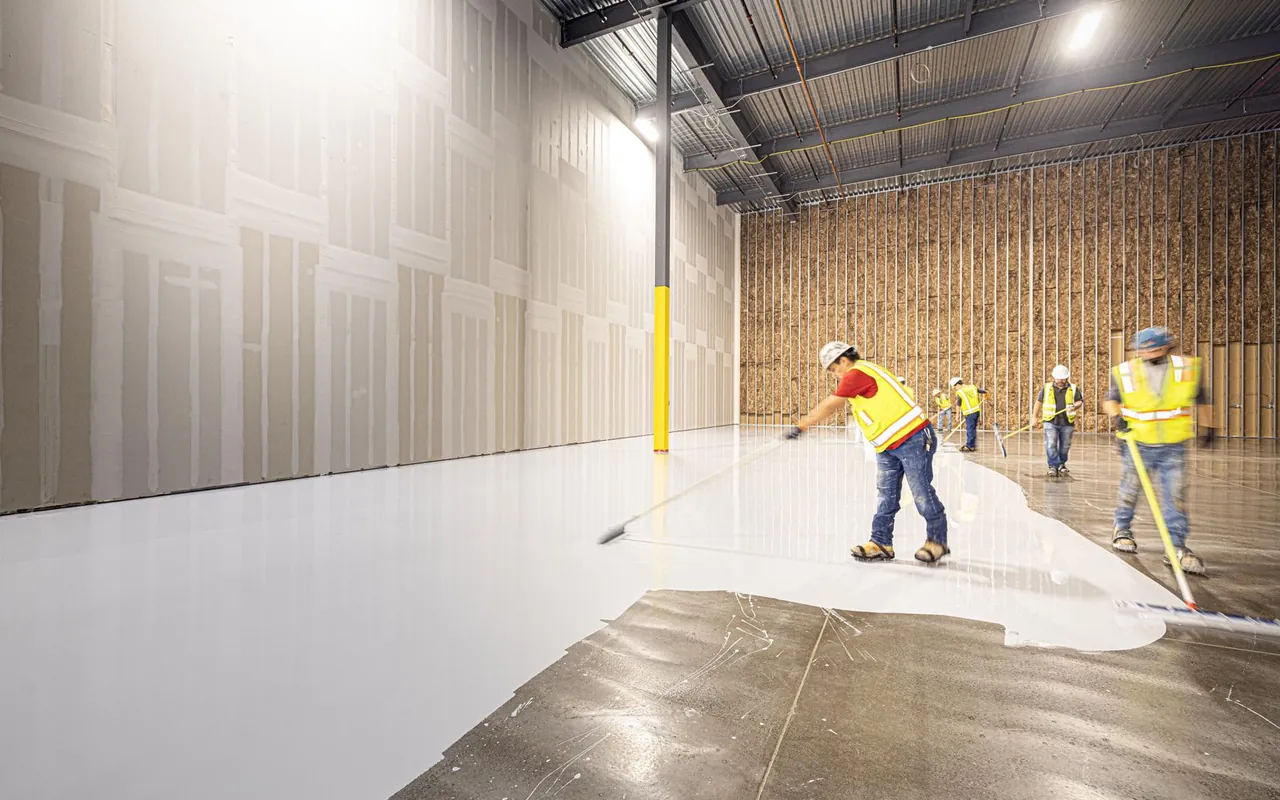 Contractor installing epoxy flooring at a home in the United States