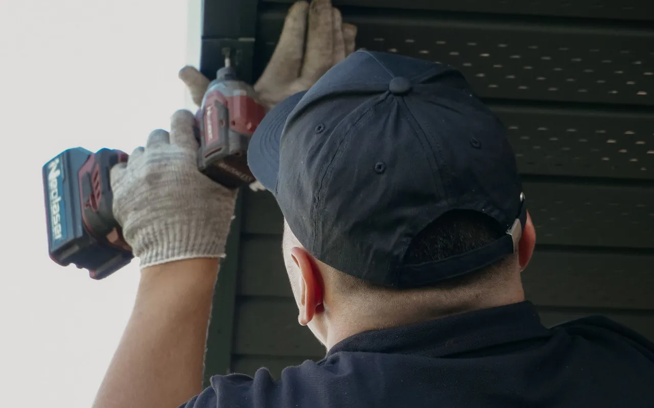Contractor installing siding at a home in the United States